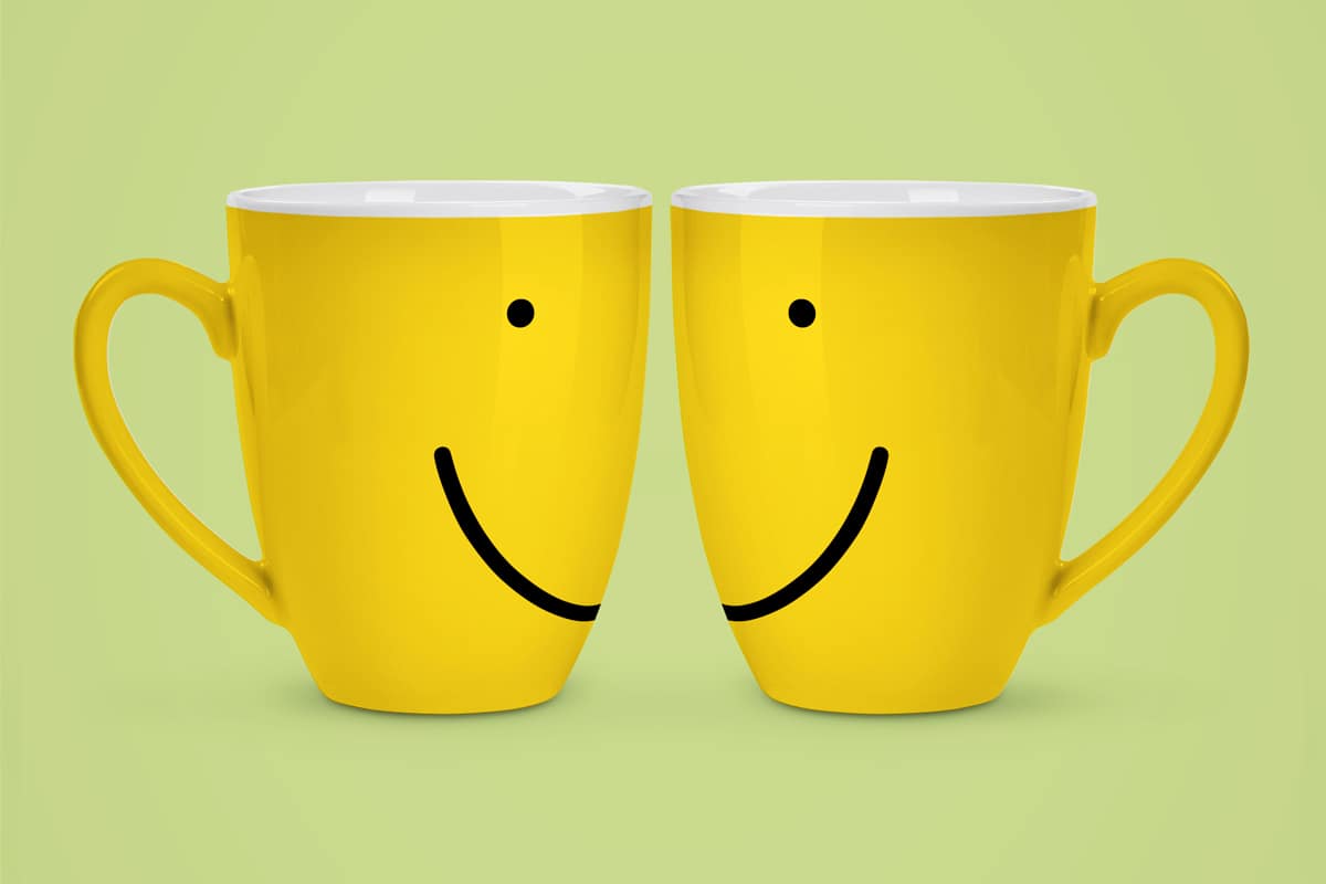 An illustration by Mariaelena Caputi of two mugs that together make up a smile.